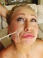 Sweet brunette gives disgusted look as cum is sprayed on her face