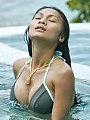 Thai goddess Tailynn posing in the sun and pool