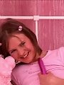 Innocent looking redhead fucks herself hard with a toy